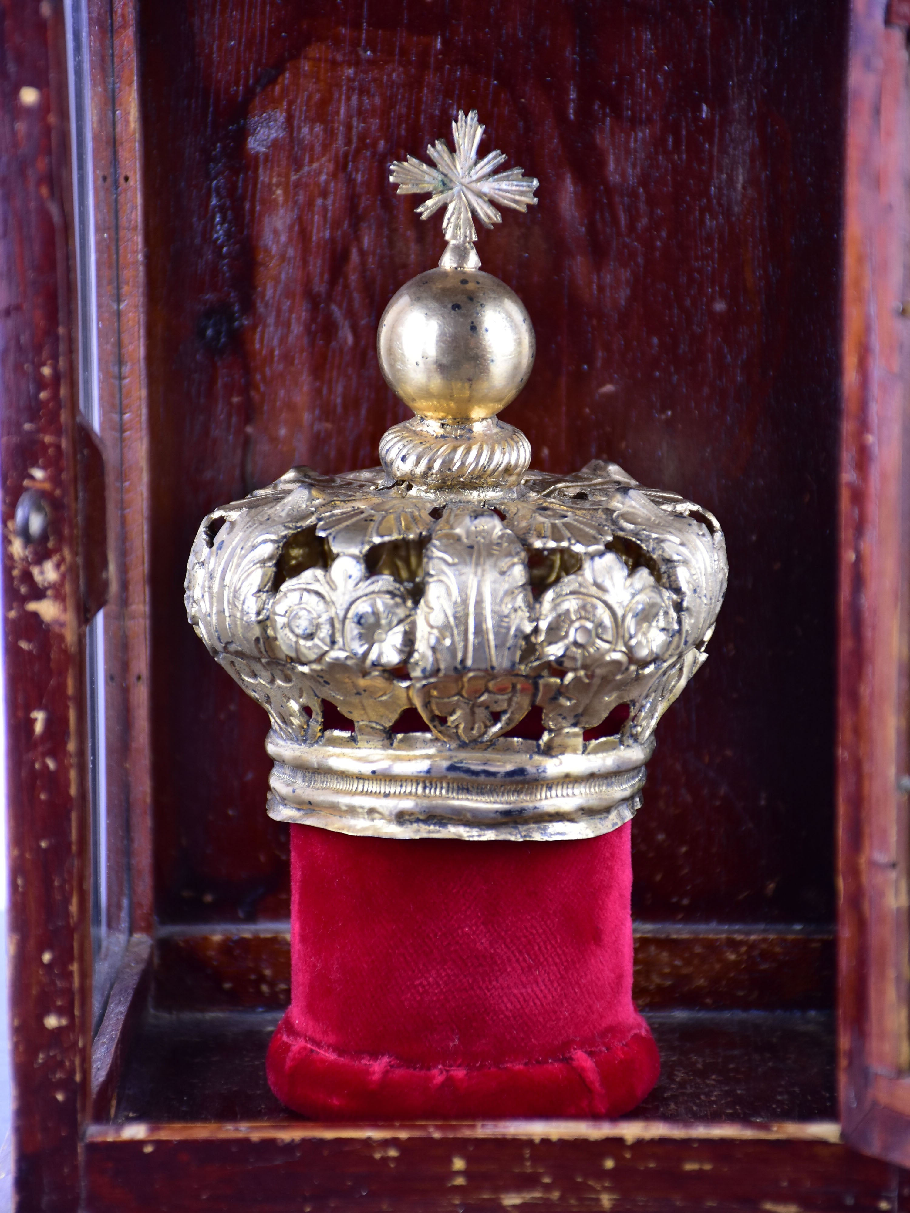 Vintage religious crown in a window box