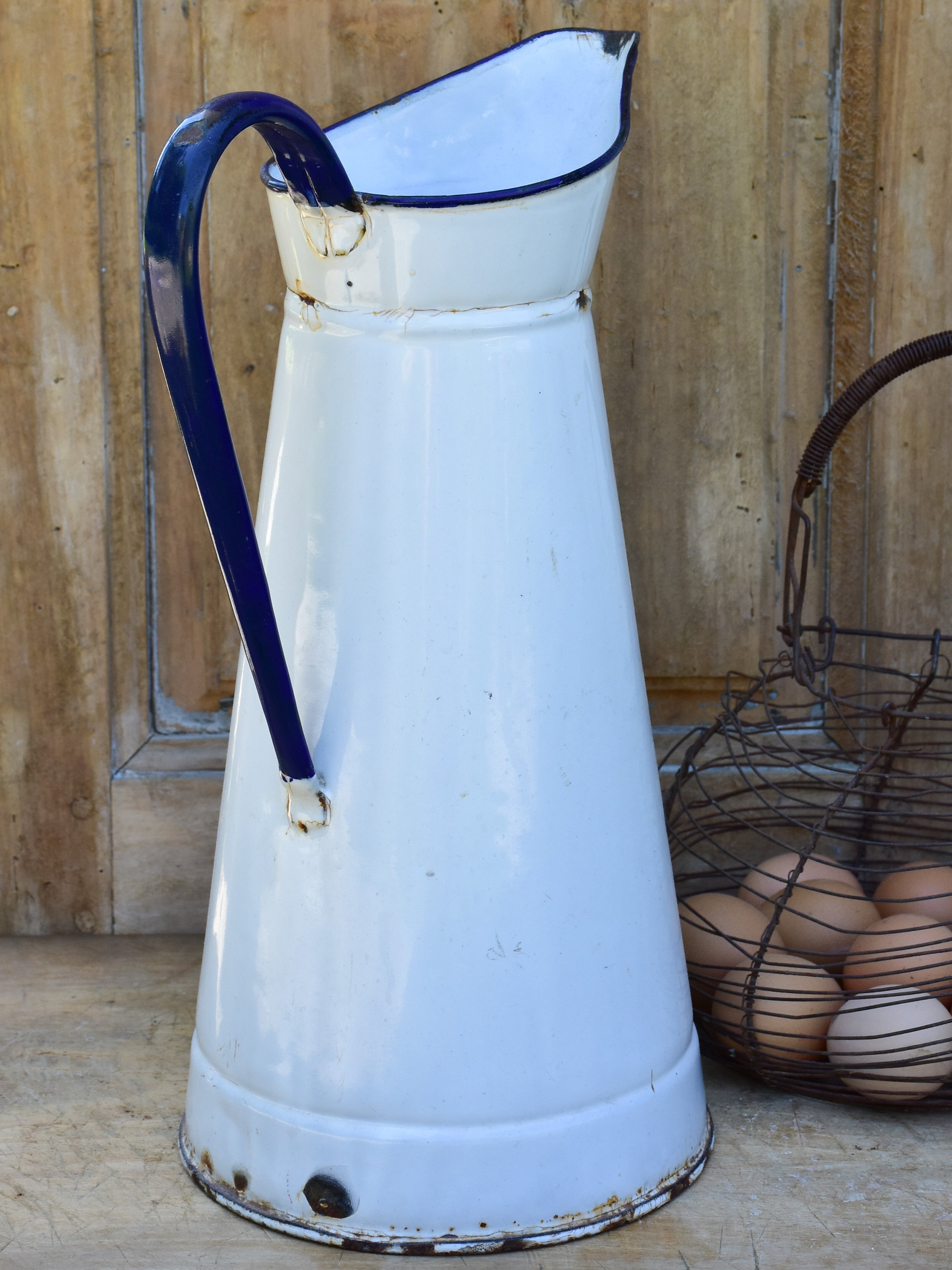 1920's enamel pitcher with blue rim