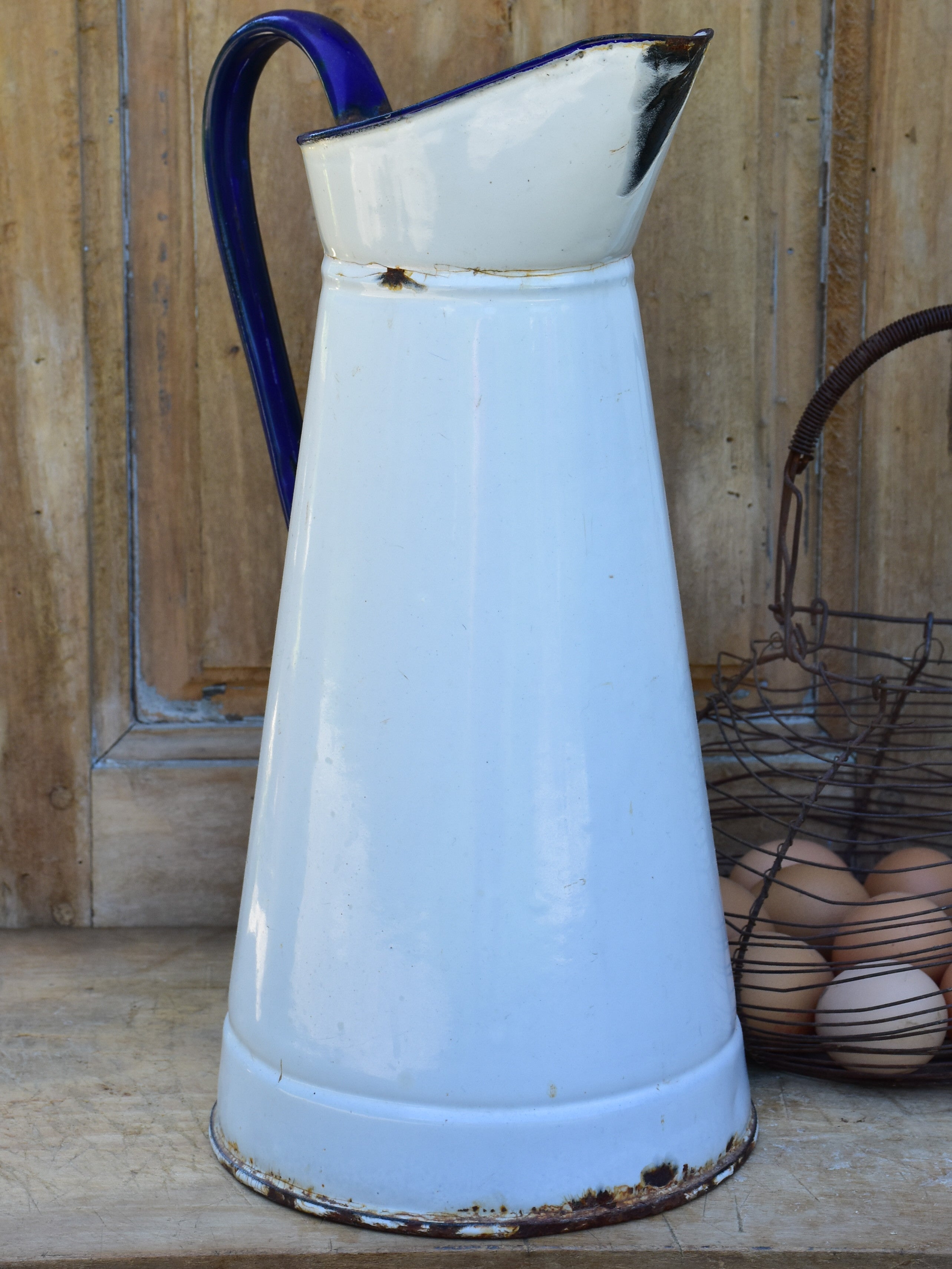 1920's enamel pitcher with blue rim