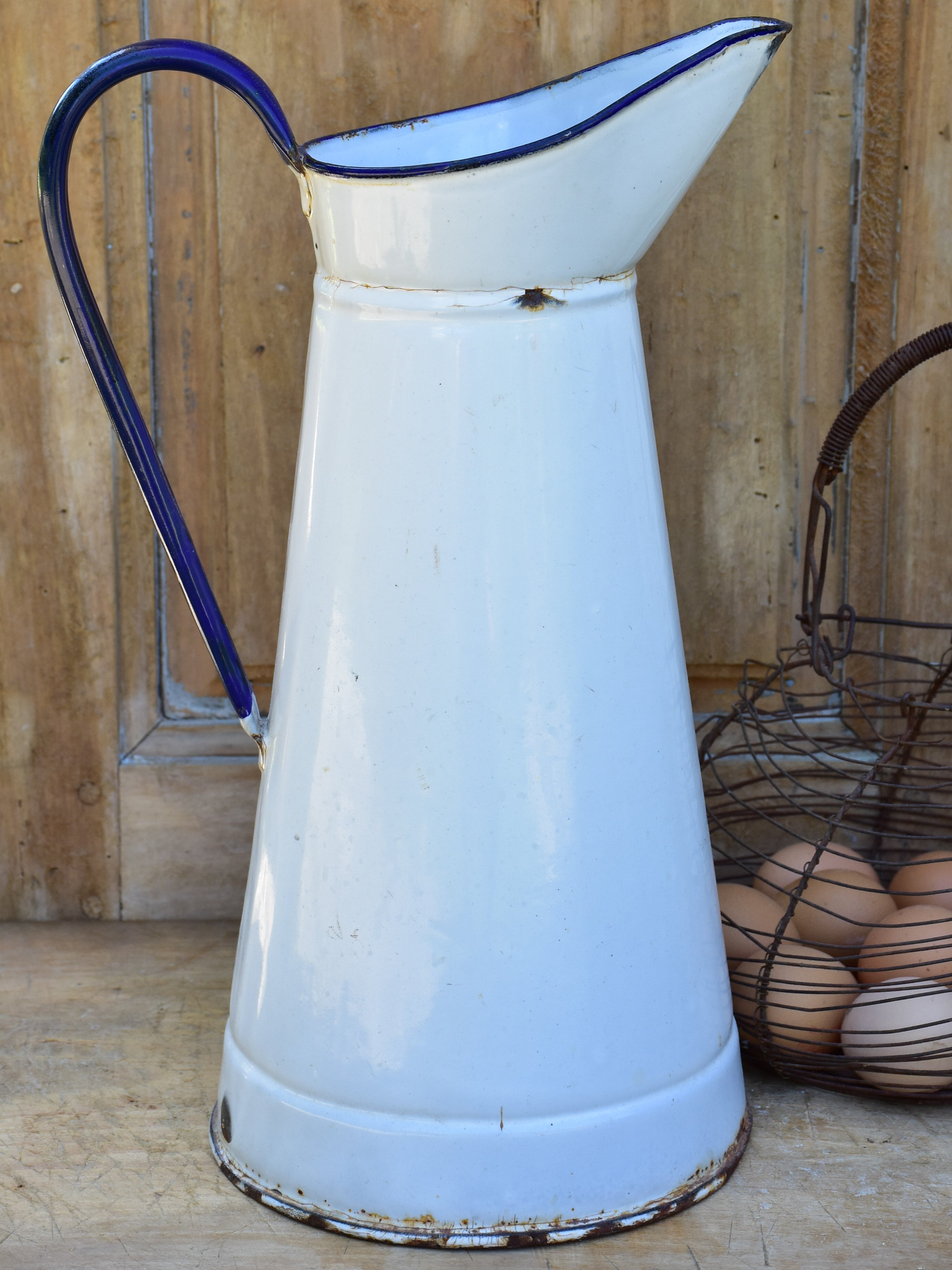 1920's enamel pitcher with blue rim