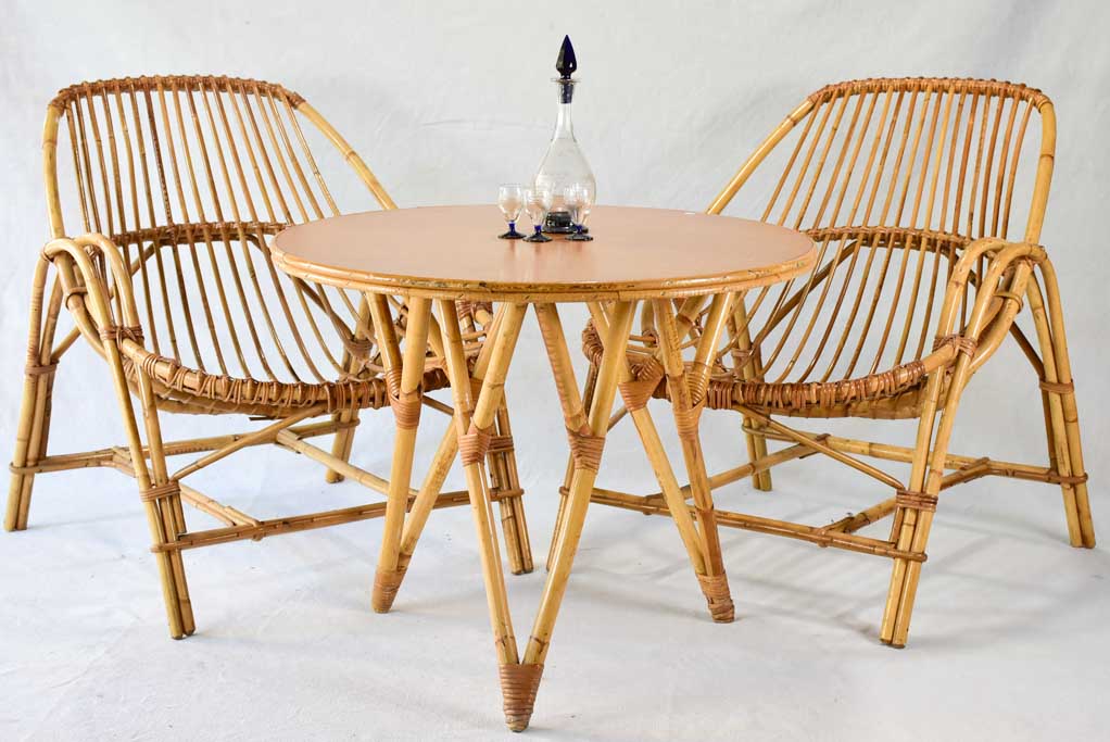 Pair of low rattan armchairs and table