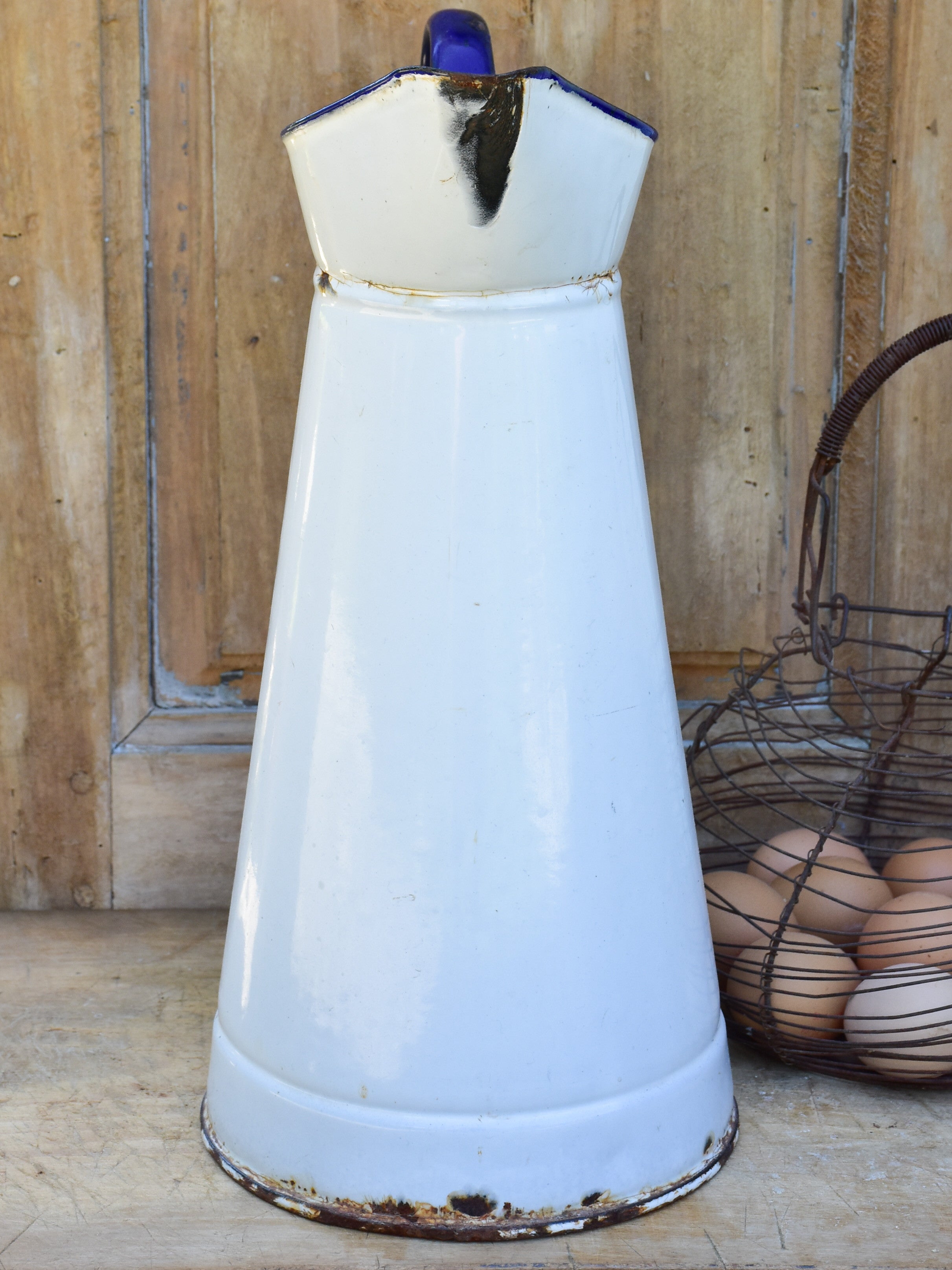 1920's enamel pitcher with blue rim