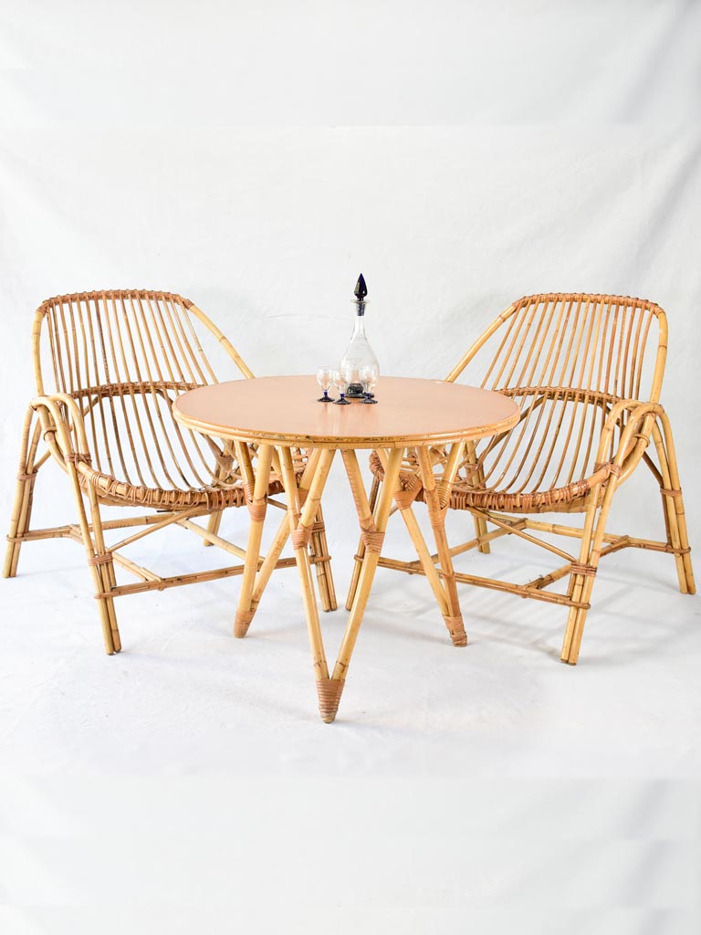 Pair of low rattan armchairs and table