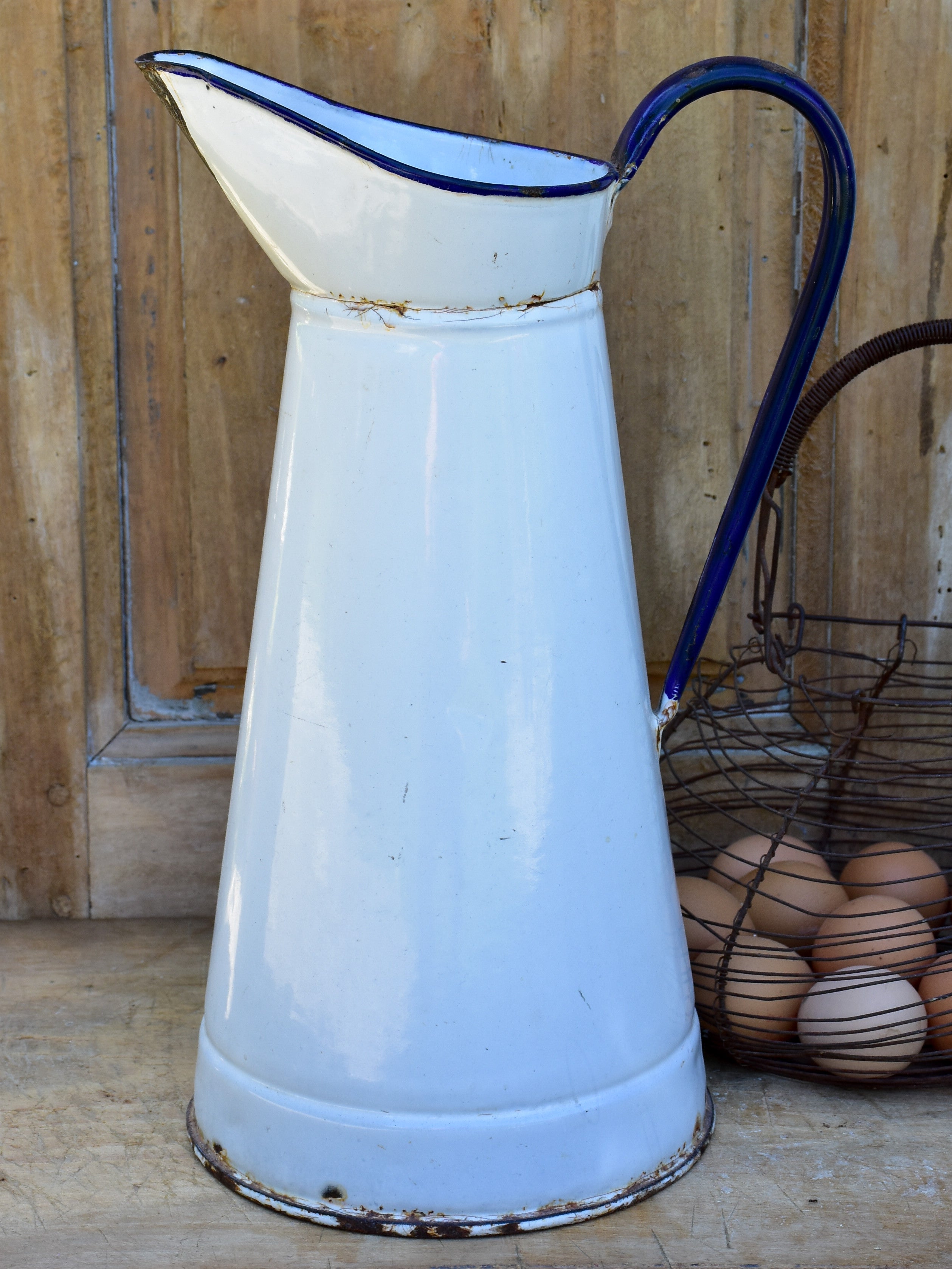 1920's enamel pitcher with blue rim