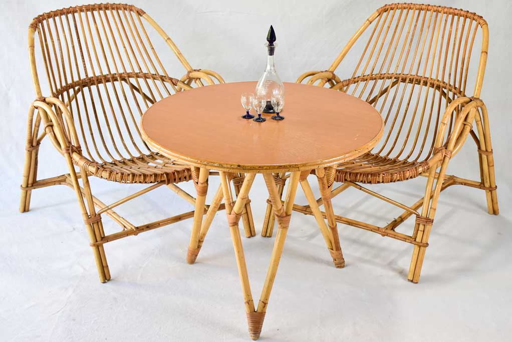 Pair of low rattan armchairs and table