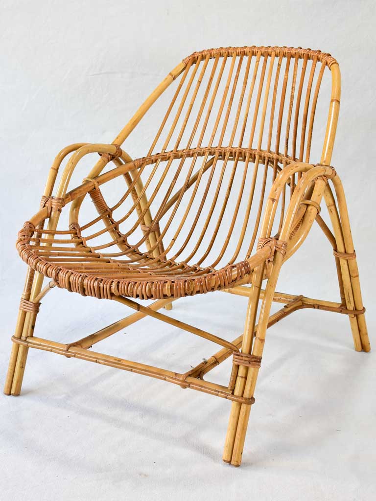 Pair of low rattan armchairs and table