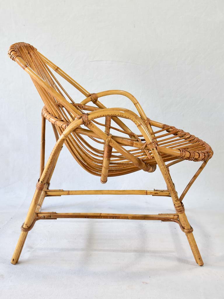 Pair of low rattan armchairs and table