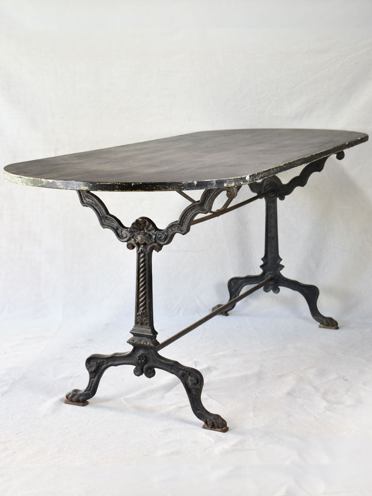 Vintage French oval table with cast-iron base 70¾" x 26¾"