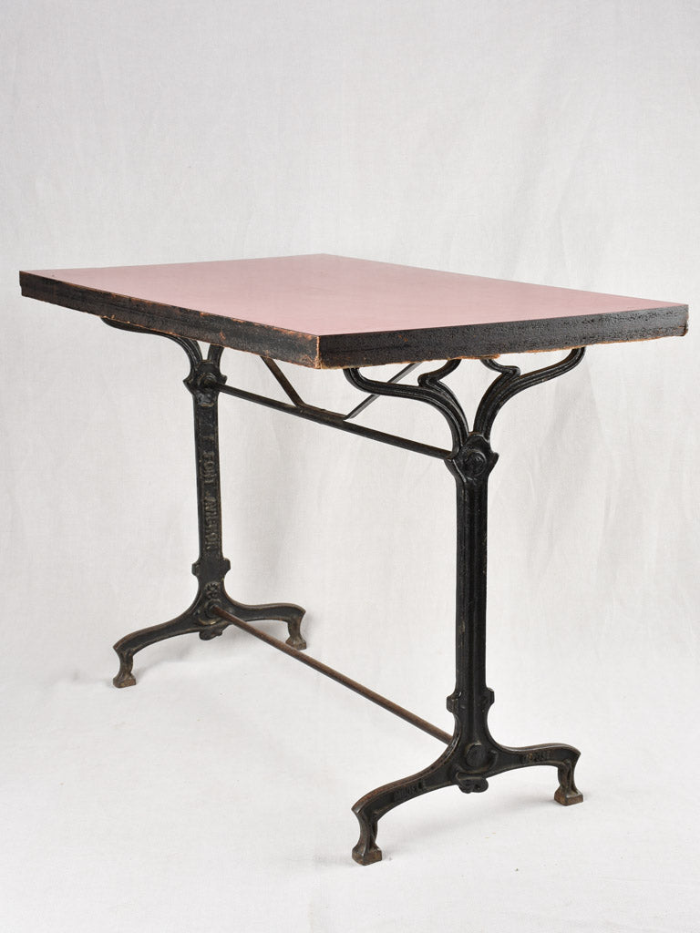 Red Formica bistro table with cast iron base (8 available)