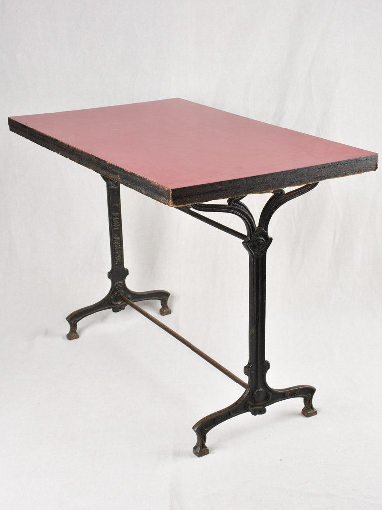 Red Formica bistro table with cast iron base (8 available)