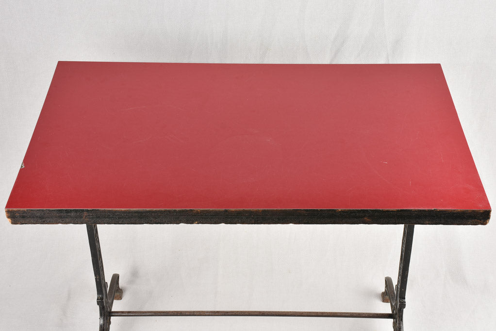 Red Formica bistro table with cast iron base (8 available)