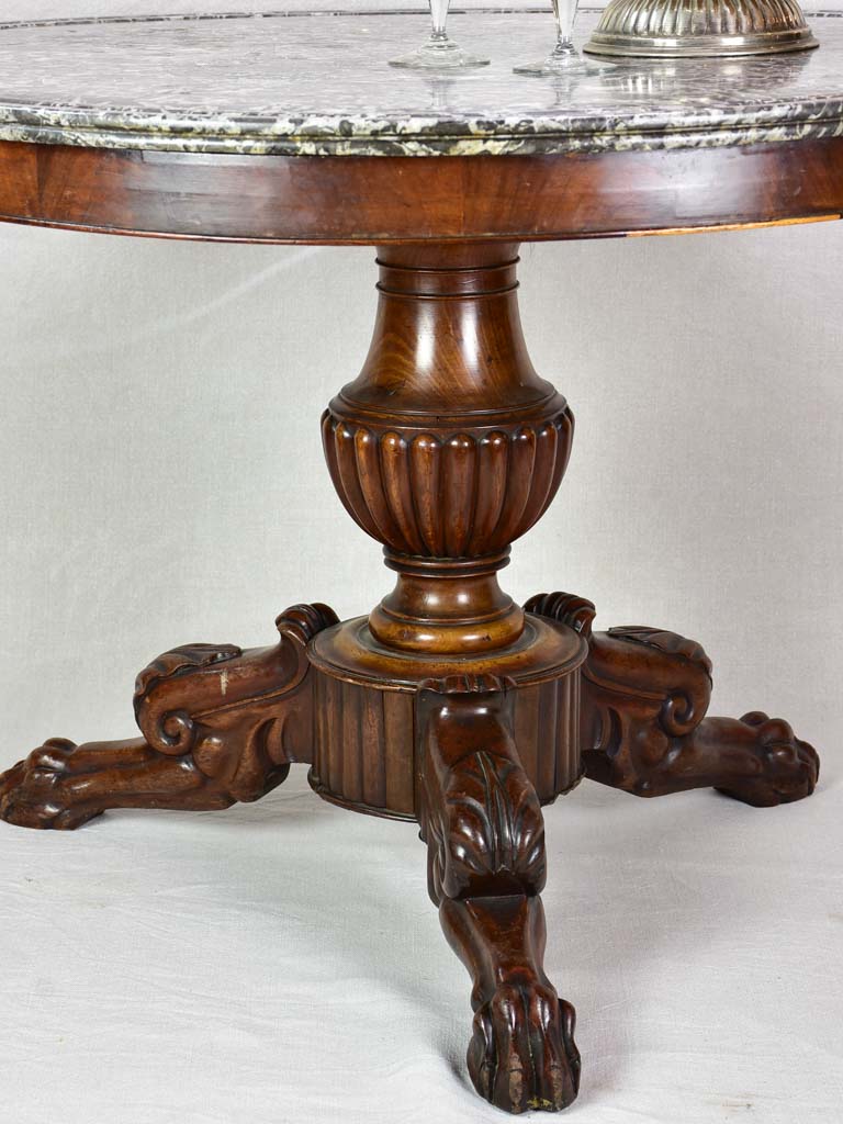 Early twentieth-century Napoleon III round center table with black marble top and claw feet 38¼"