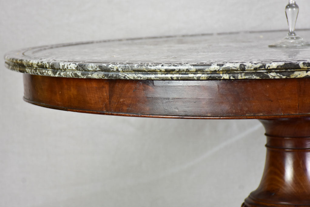 Early twentieth-century Napoleon III round center table with black marble top and claw feet 38¼"