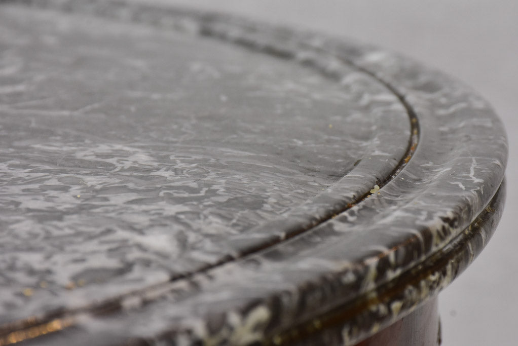 Early twentieth-century Napoleon III round center table with black marble top and claw feet 38¼"