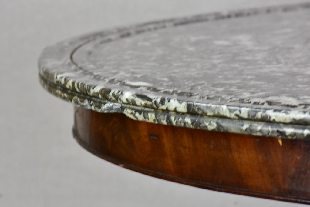 Early twentieth-century Napoleon III round center table with black marble top and claw feet 38¼"