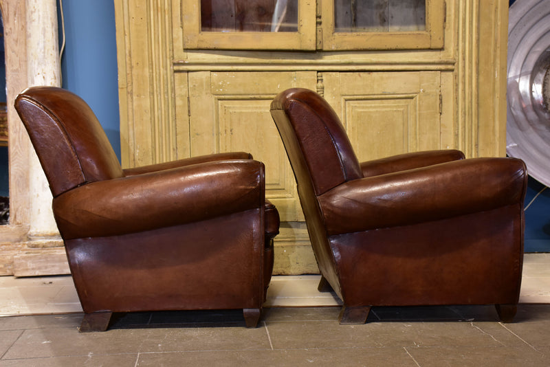 Pair of vintage French brown leather club chairs