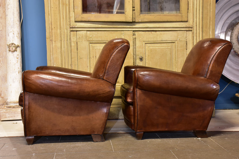 Pair of vintage French brown leather club chairs