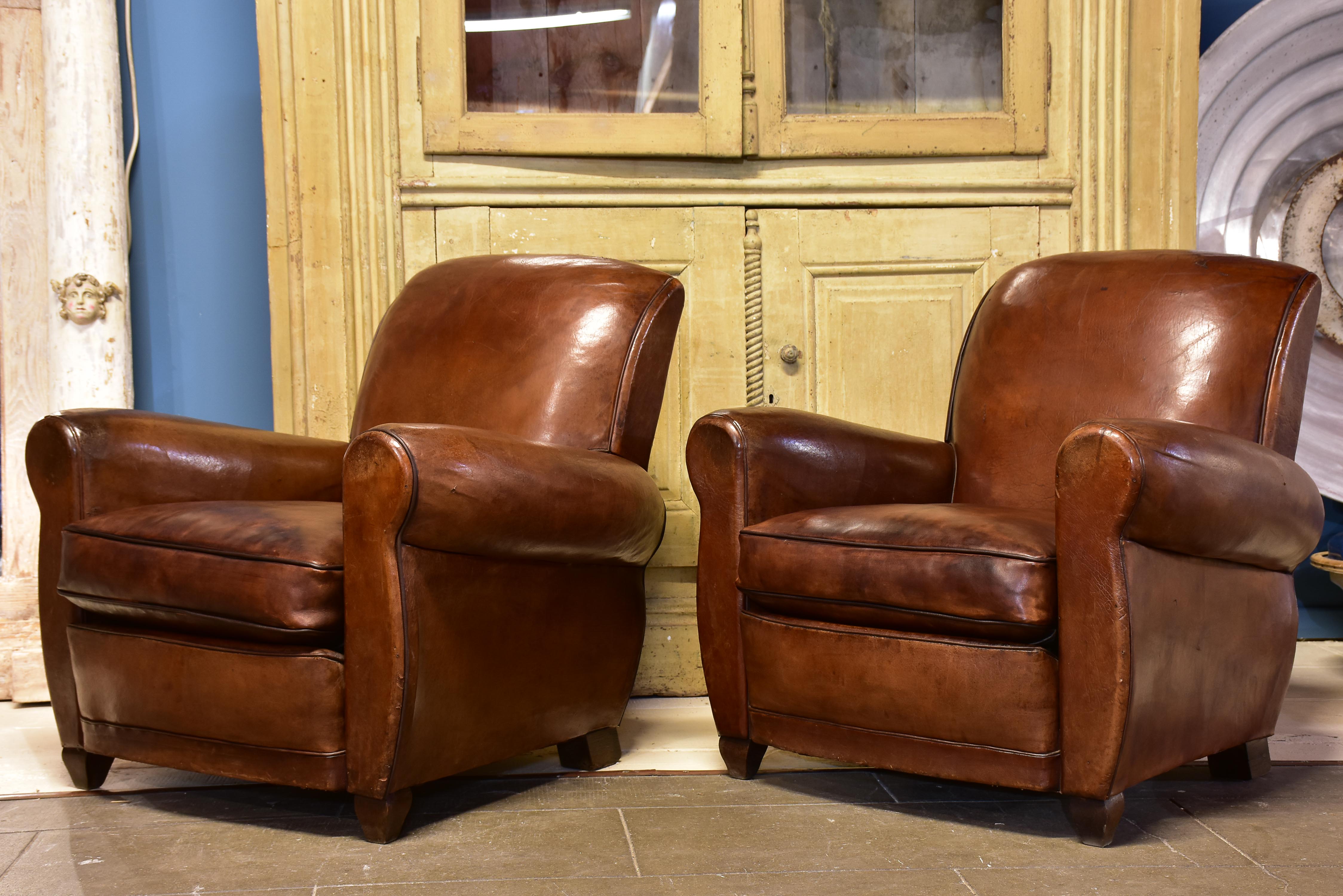 Pair of vintage French brown leather club chairs