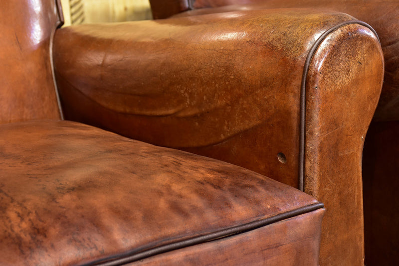 Pair of vintage French brown leather club chairs