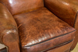 Pair of vintage French brown leather club chairs