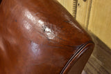 Pair of vintage French brown leather club chairs