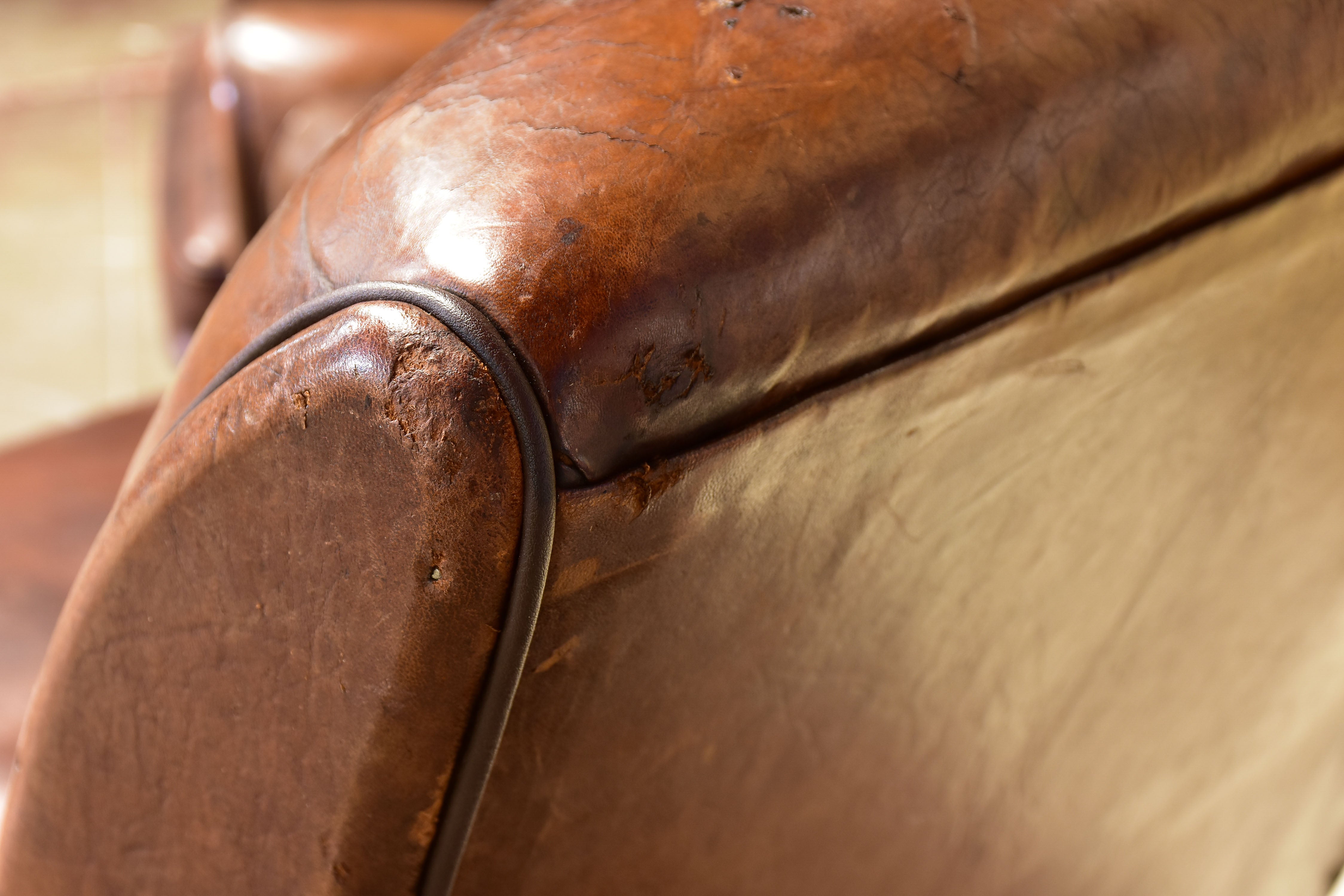 Pair of vintage French brown leather club chairs