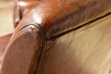 Pair of vintage French brown leather club chairs