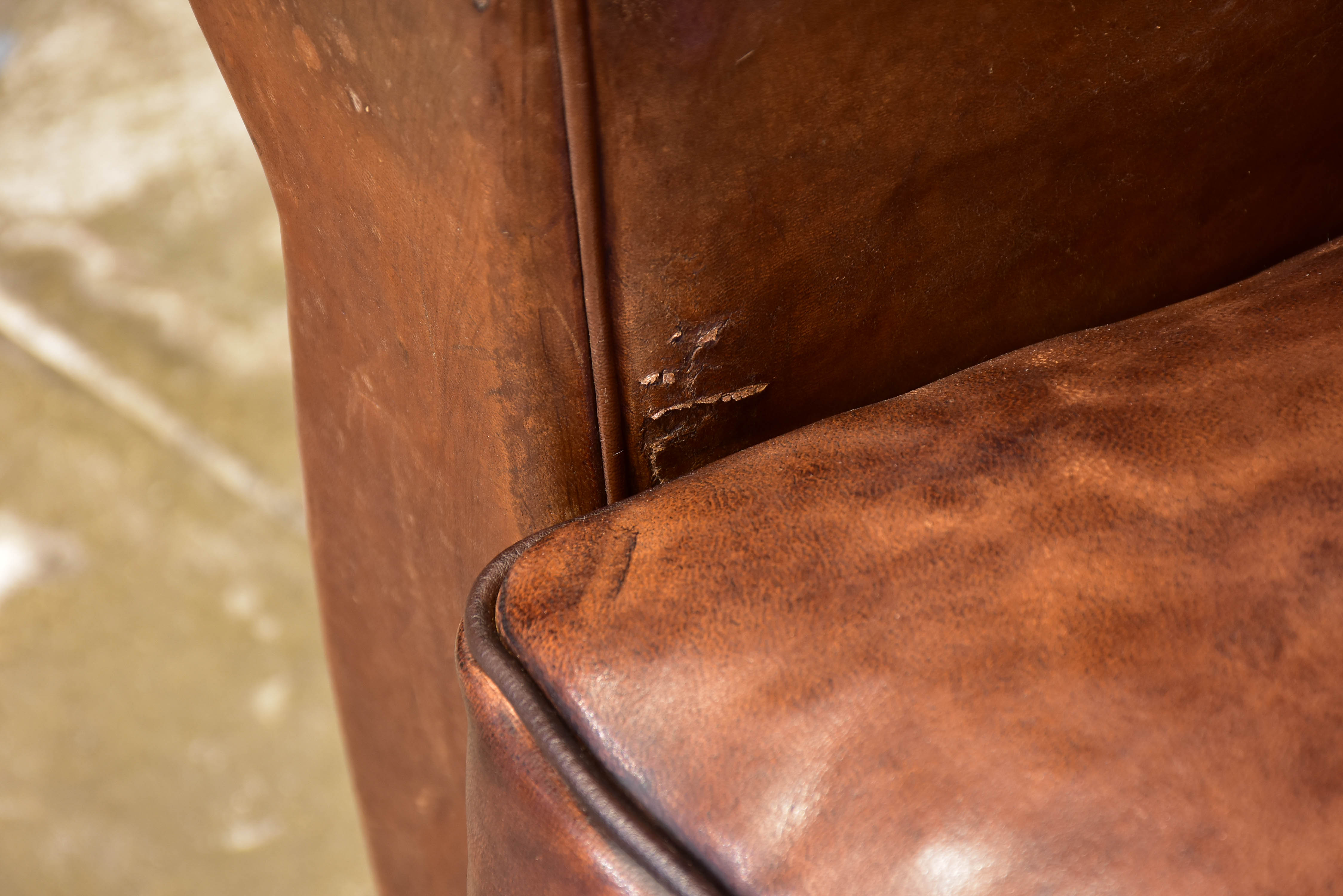 Pair of vintage French brown leather club chairs