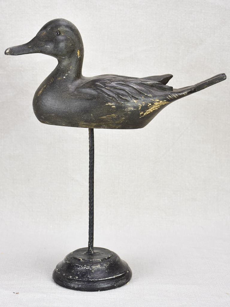 Collection of five hunting decoy ducks mounted on wooden blocks