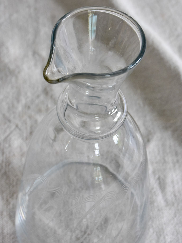 Mid century carafe with engraving and twisted stopper