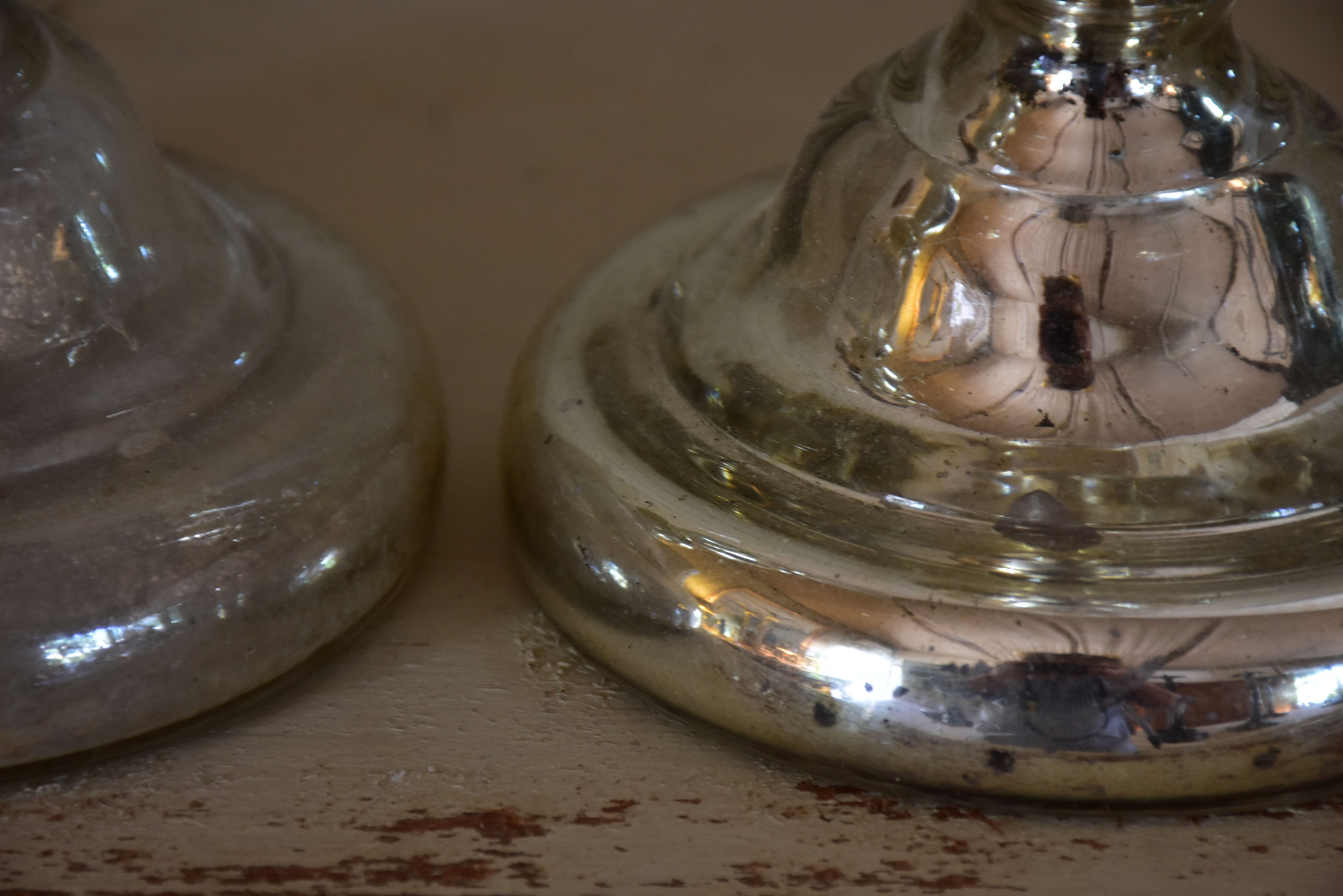 Two antique candlesticks, rustic mercury glass