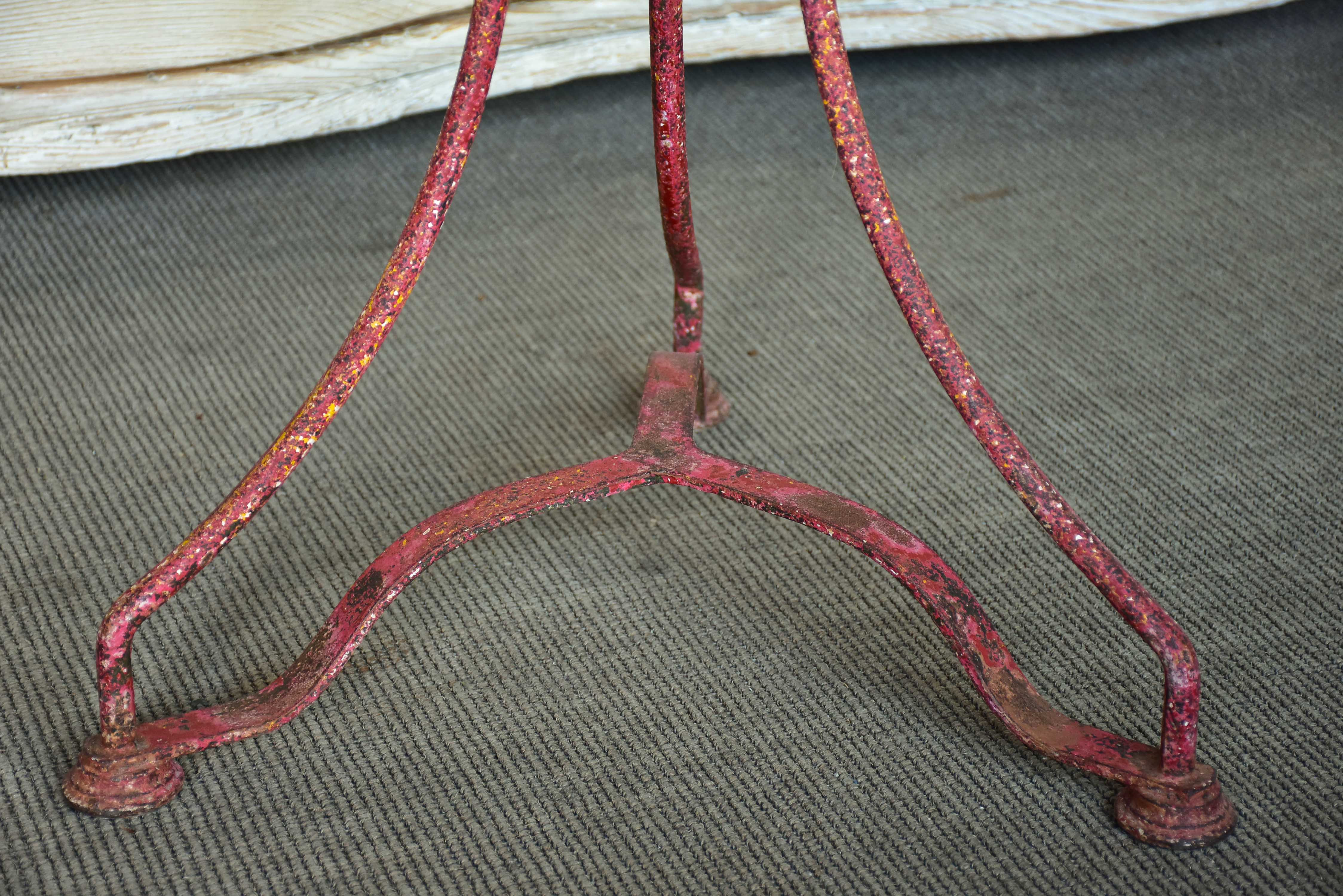 Round French garden table with red patina