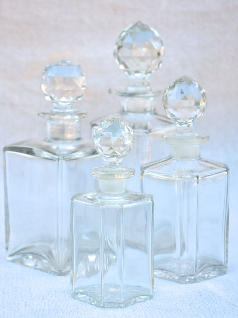 Four 1920's Baccarat perfume flasks