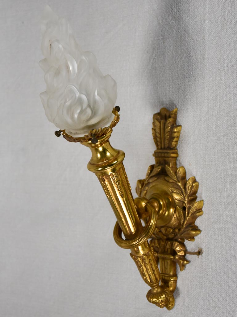 Early twentieth century torch chandelier with matching pair of wall sconces