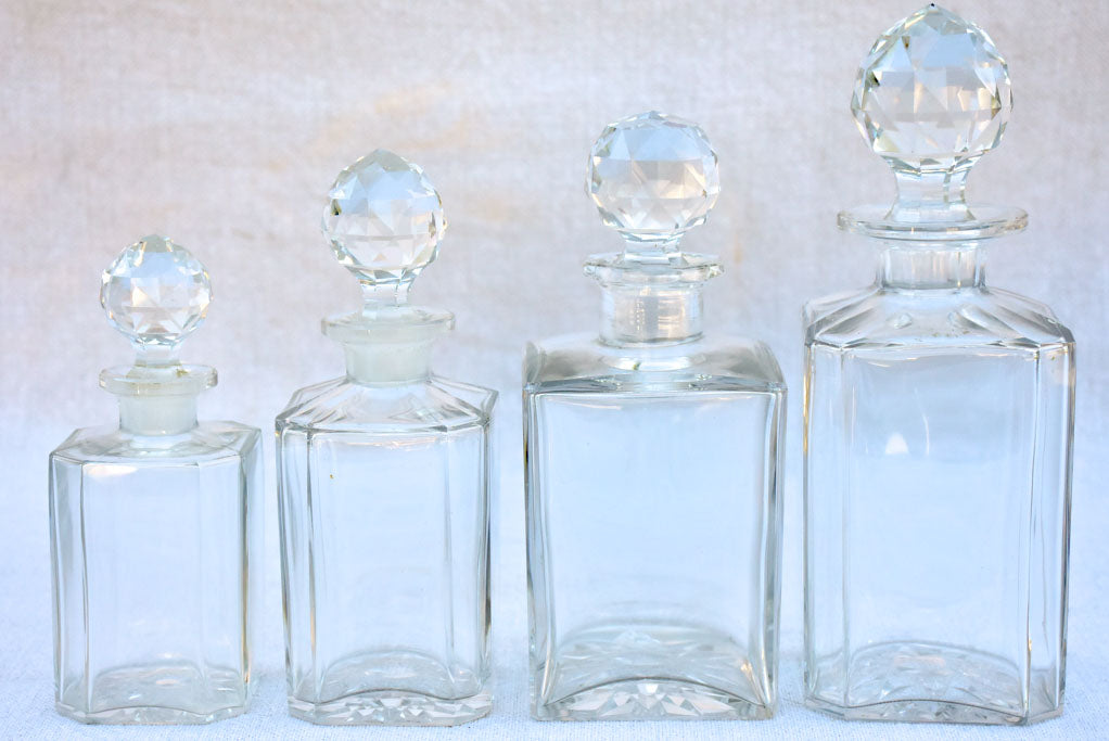 Four 1920's Baccarat perfume flasks