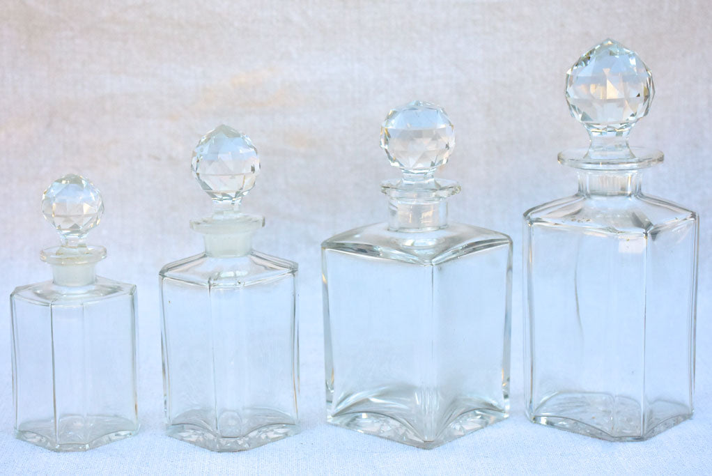 Four 1920's Baccarat perfume flasks