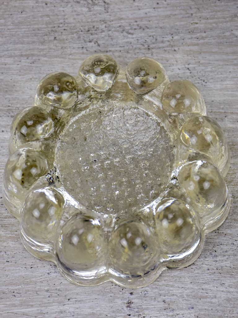 Four antique French glass table risers