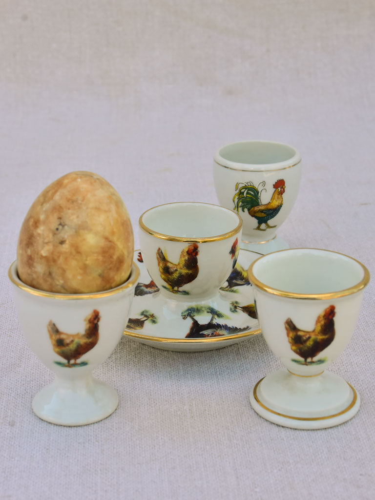 Four 1920's French porcelain egg cups with chicken and rooster transfers