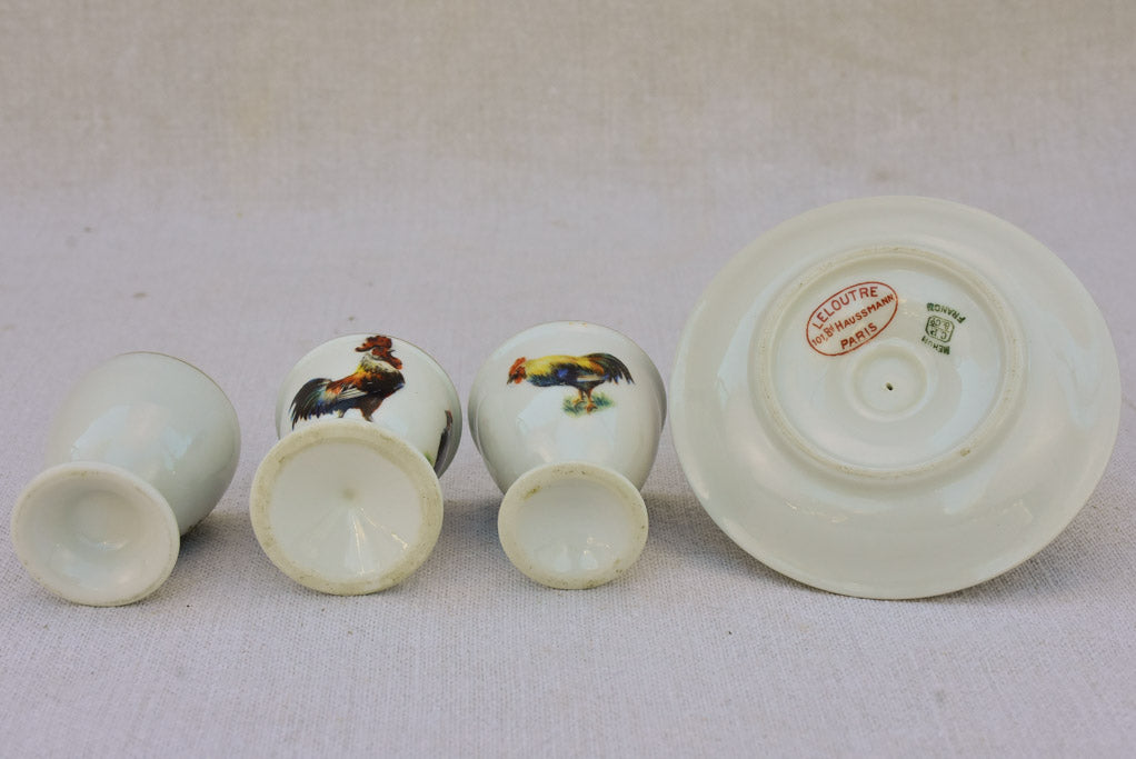 Four 1920's French porcelain egg cups with chicken and rooster transfers