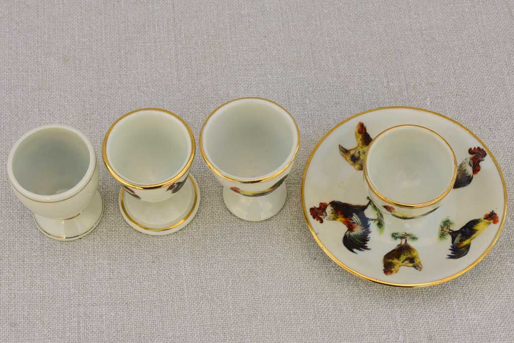 Four 1920's French porcelain egg cups with chicken and rooster transfers