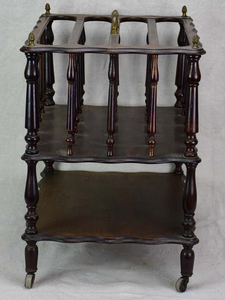 Antique French magazine rack on casters