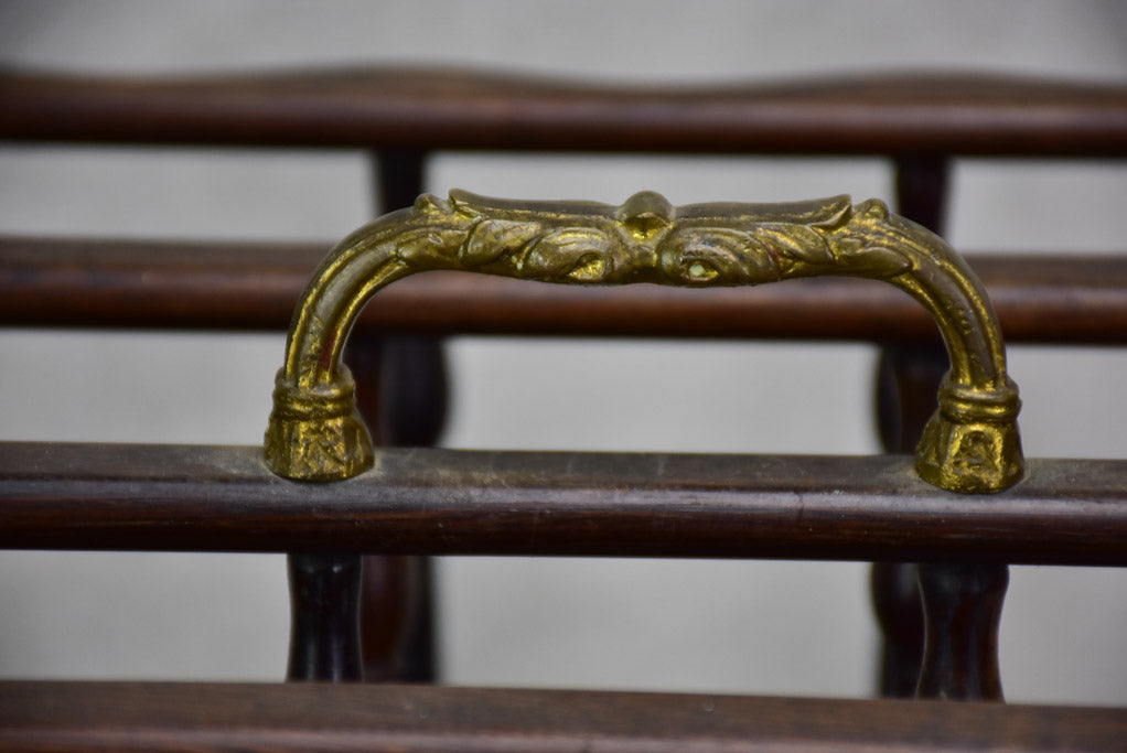 Antique French magazine rack on casters