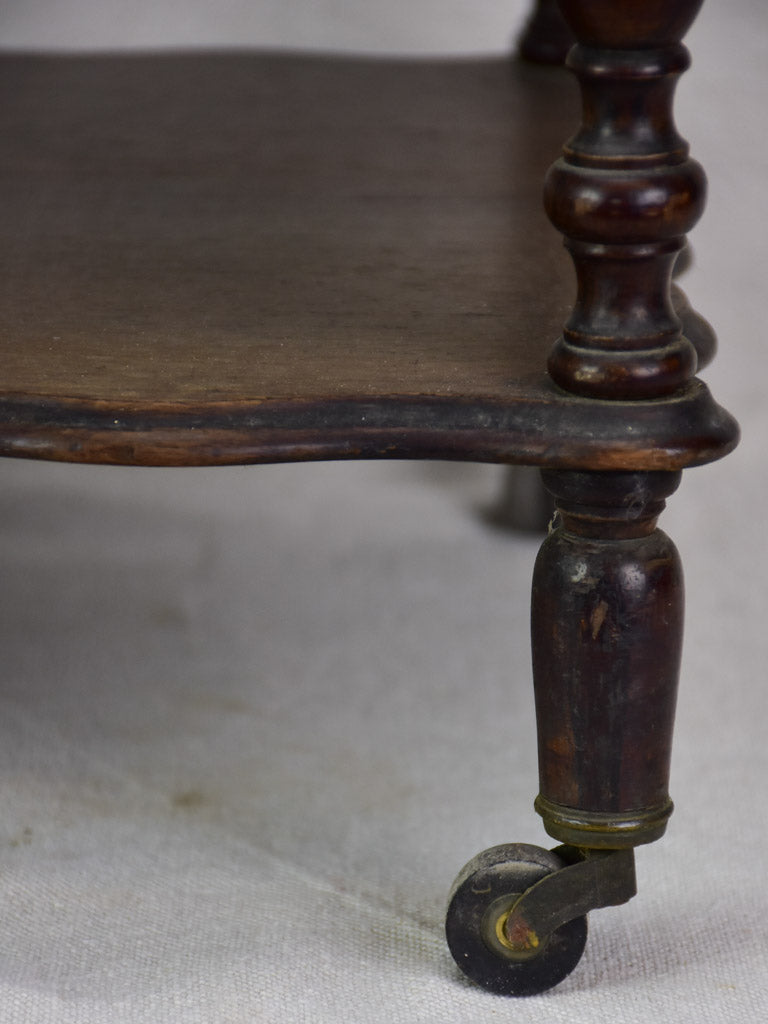 Antique French magazine rack on casters