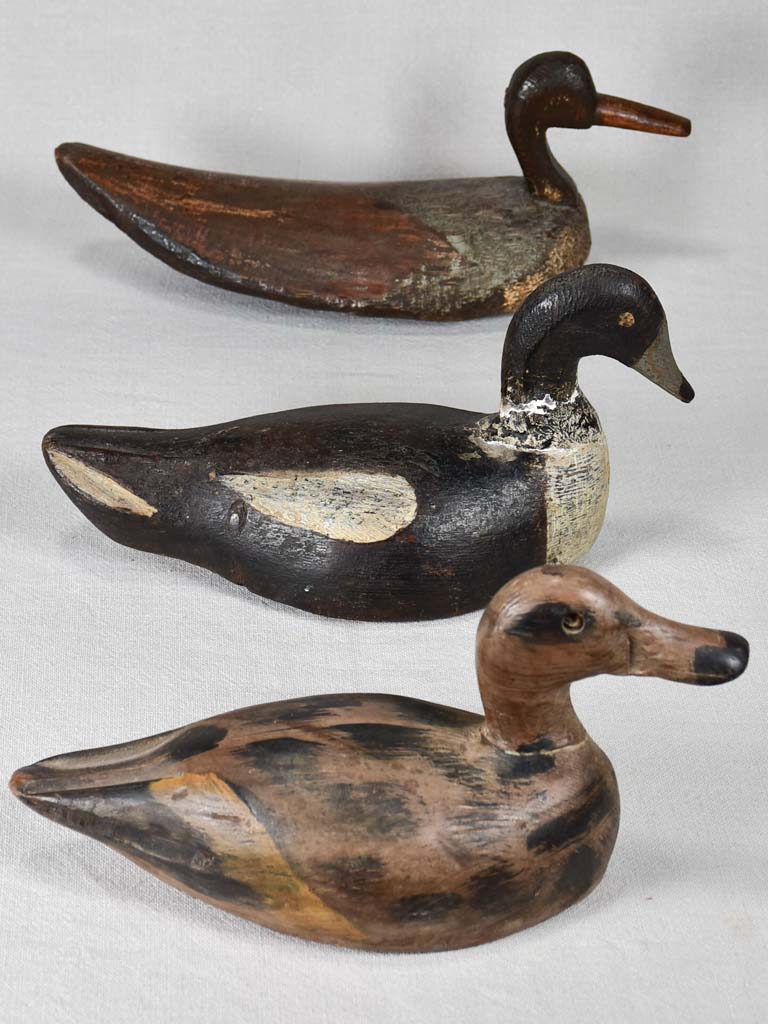 Three vintage wooden decoy ducks