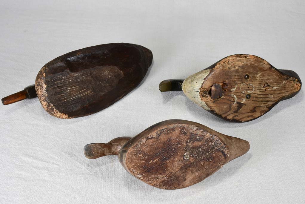 Three vintage wooden decoy ducks