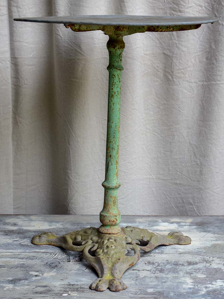 Round antique French garden table with claw feet