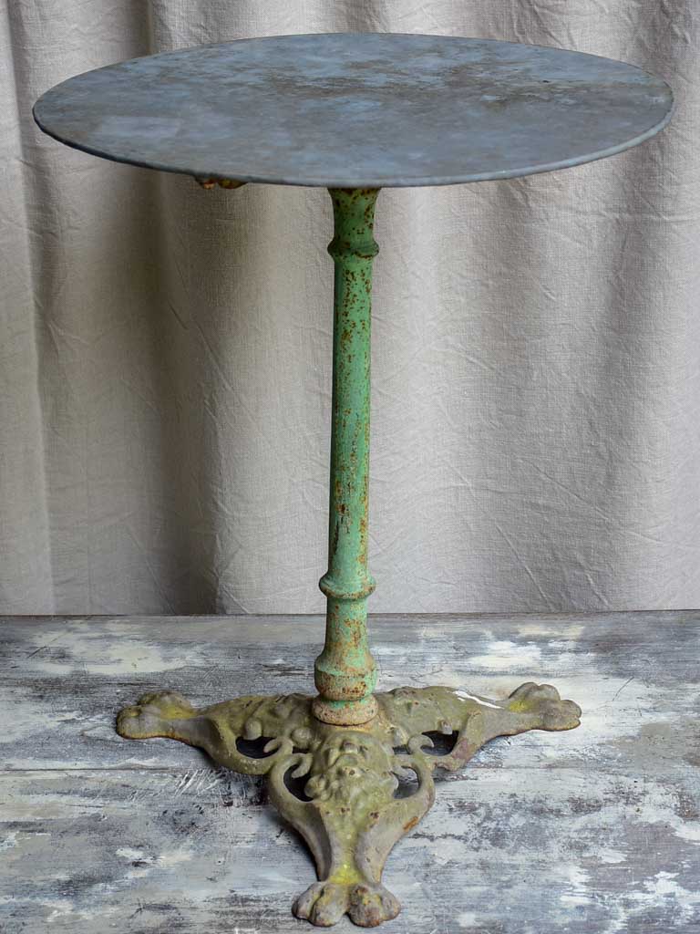 Round antique French garden table with claw feet