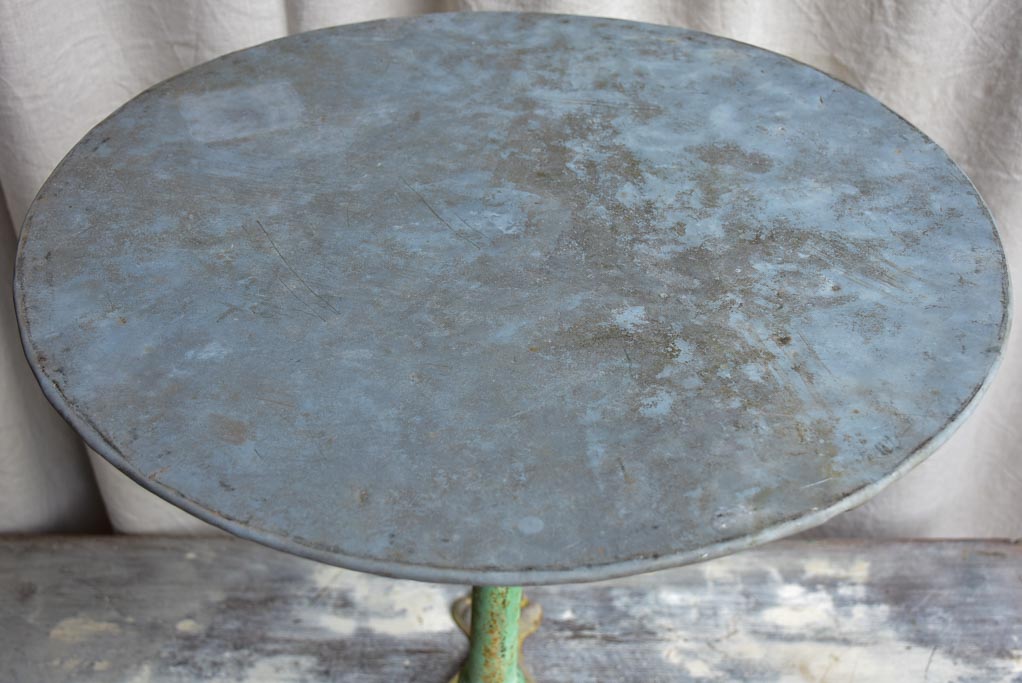 Round antique French garden table with claw feet