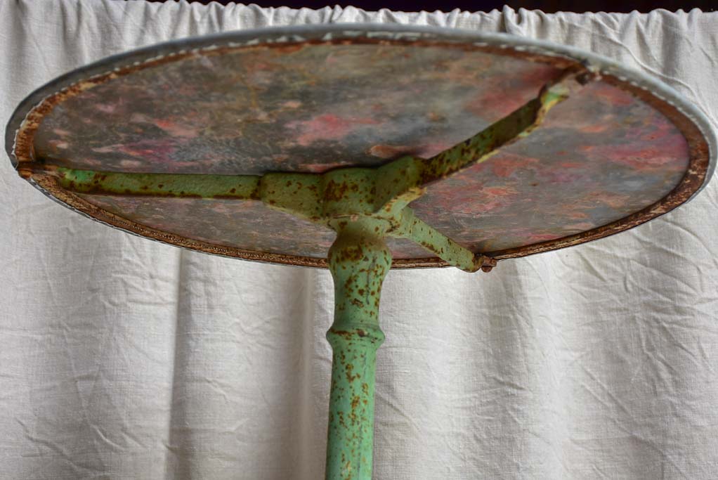 Round antique French garden table with claw feet