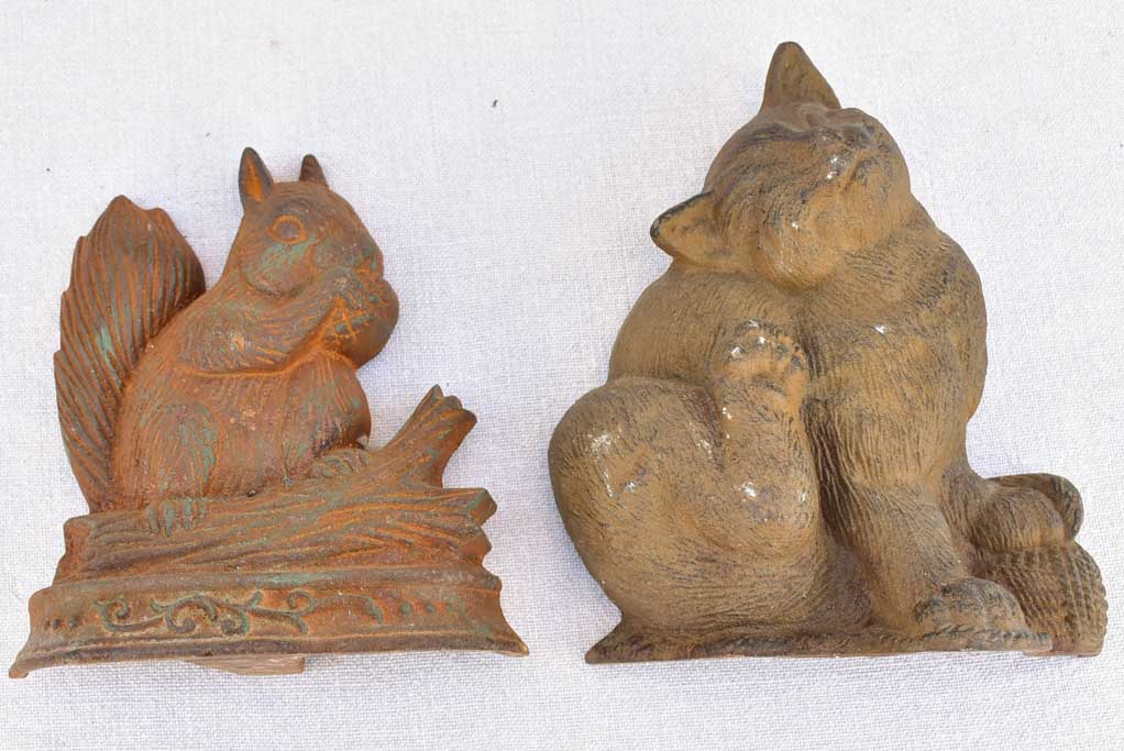 Two vintage French cast iron doorstops - cat and squirrel